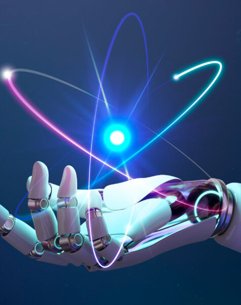 A robot hand holding a heart shaped object.