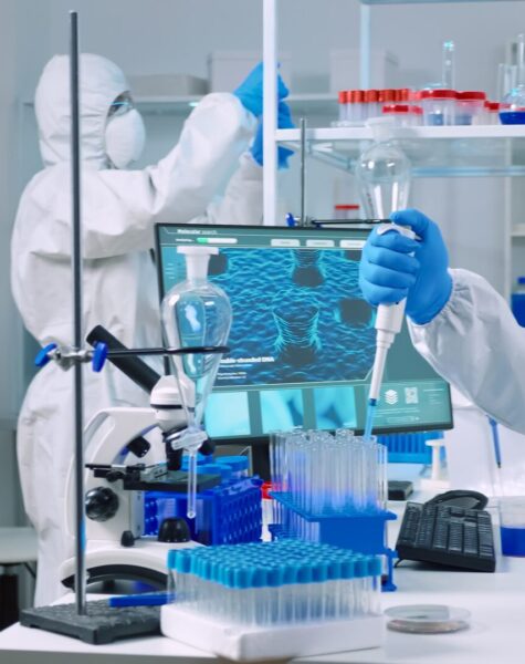 scientist-wearing-coverall-equipped-medical-laboratory-examining-drug-discovery-with-micropipette-biochemists-analysing-virus-evolution-using-high-tech-researching-vaccine-against-covid19